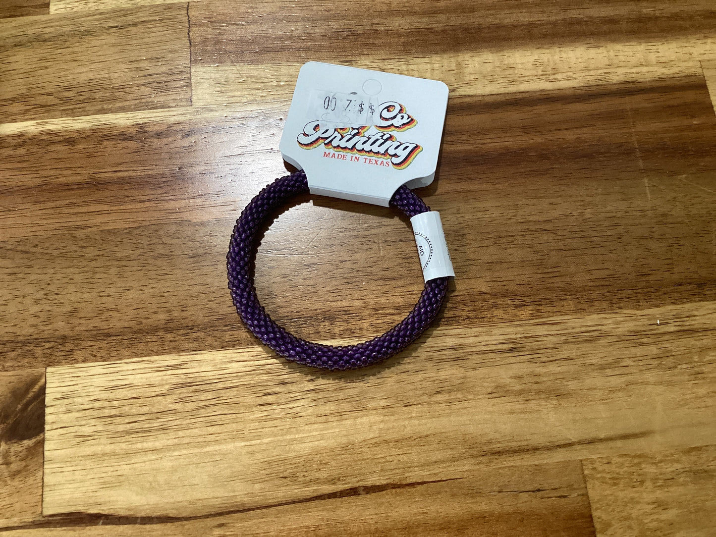 purple, gold, and white Beaded bracelet