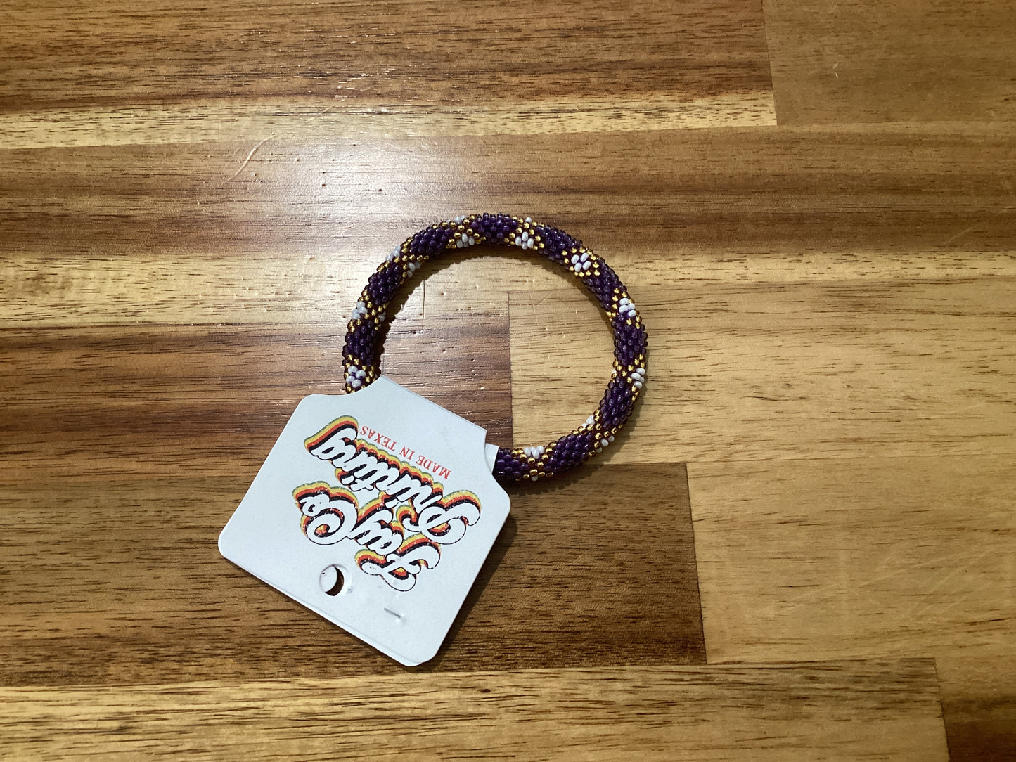 purple, gold, and white Beaded bracelet