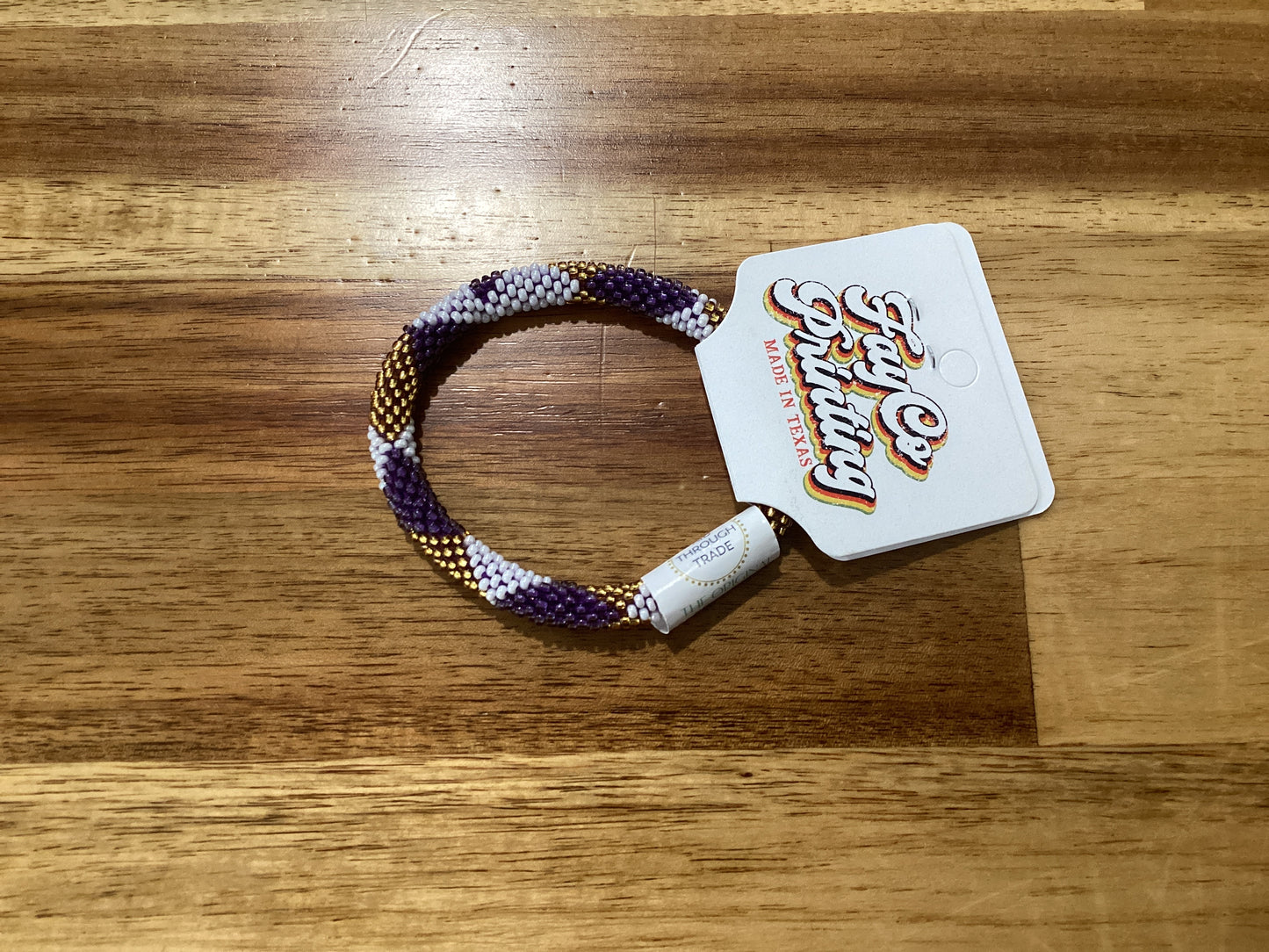 purple, gold, and white Beaded bracelet
