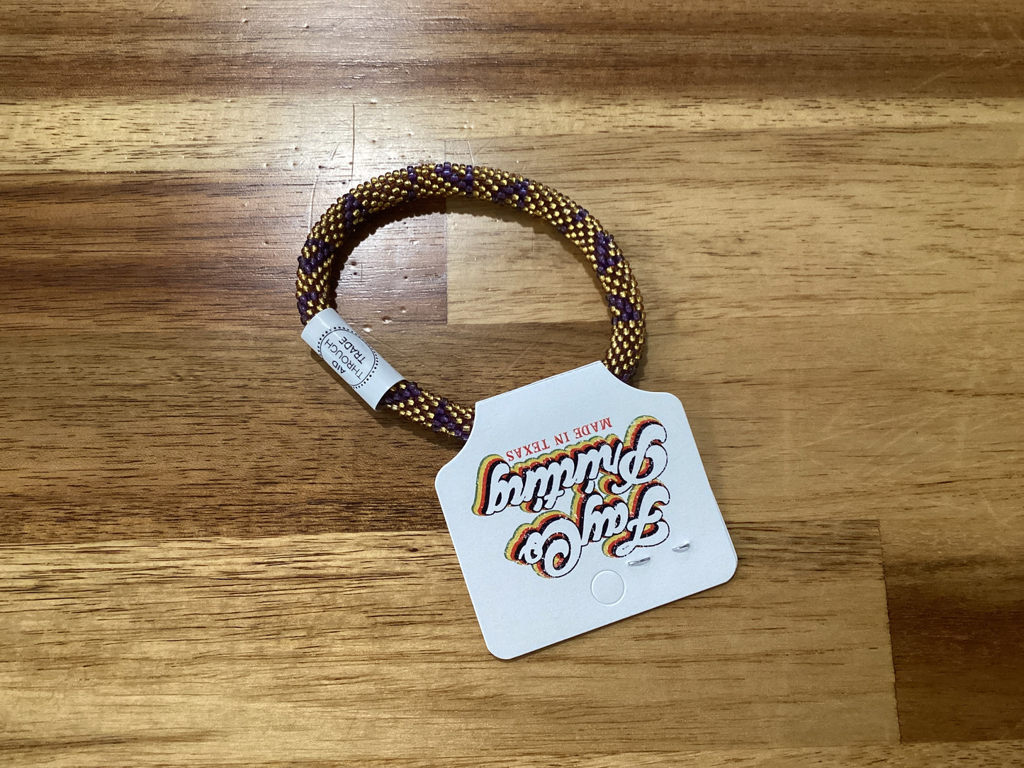 purple, gold, and white Beaded bracelet